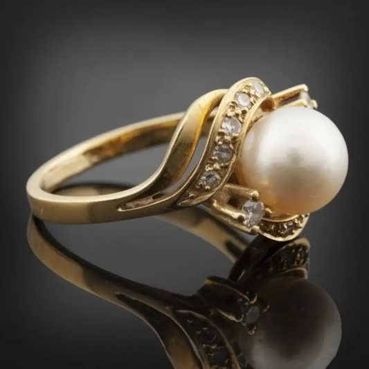 Elegante anello con perla e oro brillante 